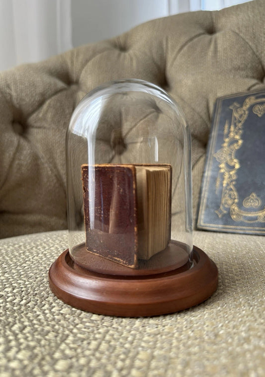 Display of Antique Miniature Bible 1857 In A Glass Dome