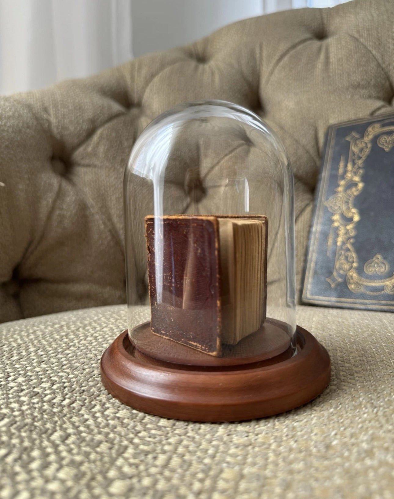 Display of Antique Miniature Bible 1857 In A Glass Dome